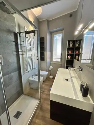 a bathroom with a sink and a shower and a toilet at Roma San Pietro alloggio turistico Casa Patrizia in Rome