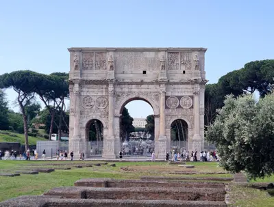 ancient arch in the middle of a park at Re di Room in Rome