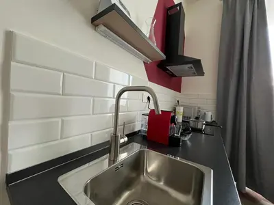 a kitchen counter with a sink in a kitchen at Quattro fiori apartment in Rome