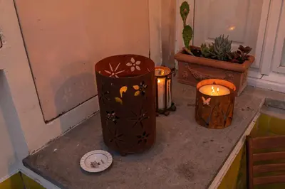 a couple of trash cans sitting on a counter with candles at Giulia's House, Monti in Rome