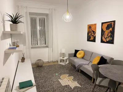 a living room with a couch and a table at Luxury Apartment in Prati in Rome