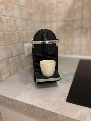 a coffee maker sitting on top of a counter at Luxury Apartment in Prati in Rome
