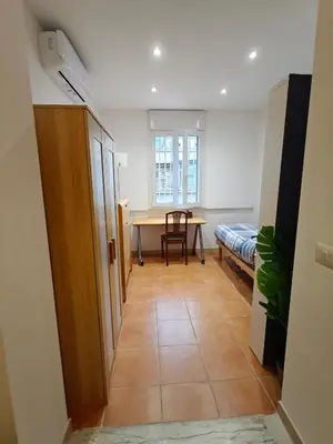a room with a table and a chair and a table at CasAdelia in Rome