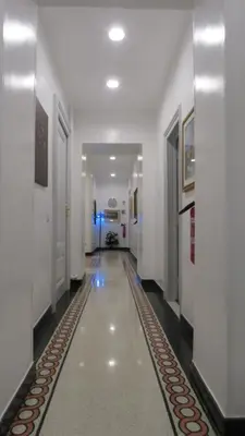 a hallway of a building with a long corridor at Sweet Home Inn in Rome