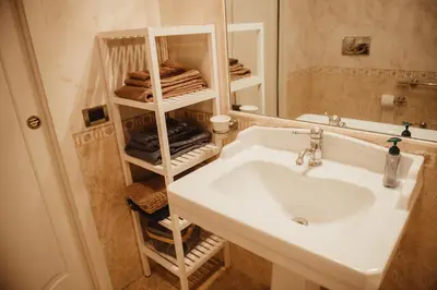 a bathroom with a sink and a mirror at Quo Vadis APT in Rome
