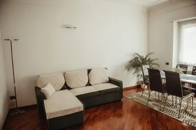 a living room with a couch and a table at Quo Vadis APT in Rome