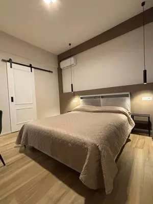 a bedroom with a large bed and a window at Eva suite in Rome