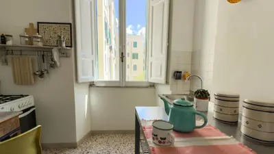 a kitchen with a table with a teapot on it at Vintage Vibes in Testaccio - Cale 07 in Rome