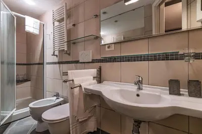 a bathroom with a sink and a toilet at Domus Campo de Fiori in Rome