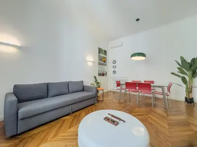 a living room with a couch and a table at Casa Alessandria in Rome