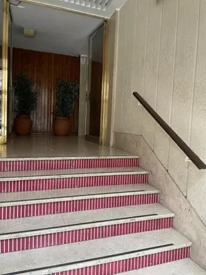 a set of red stairs in a building at Next Stop Vatican Guest House in Rome