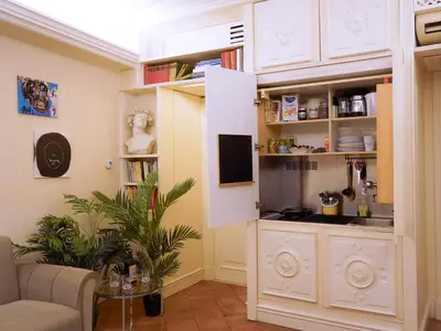a living room with a white cabinet and a tv at Best Location in Rome -Historical Center in Rome