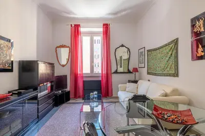 a living room with a couch and a tv at Flaminio Tiepolo bright and central in Rome in Rome