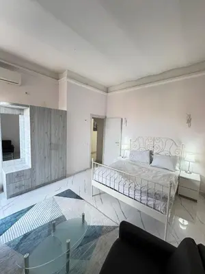 a bedroom with a bed and a living room at BANGA HOUSe in Rome