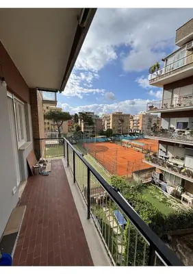 a balcony with a tennis court on a court at Bonci Rooms - Appartamento in zona Policlinico Gemelli, Università Cattolica, Vaticano, Stadio Olimpico in Rome