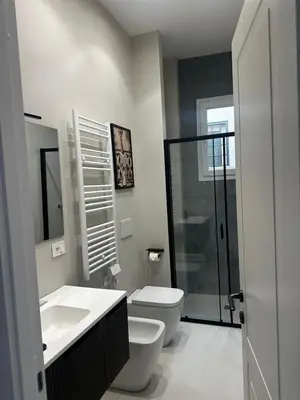 a bathroom with a toilet and a sink and a shower at Casa Conce two metro stops from the colosseum in Rome