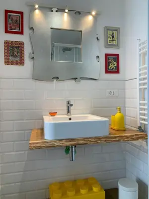 a bathroom with a white sink and a mirror at Casa Fabio - Cornelia Metro A in Rome