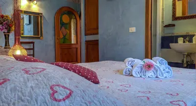 a bedroom with a bed with towels and a sink at B&B Prati in Rome