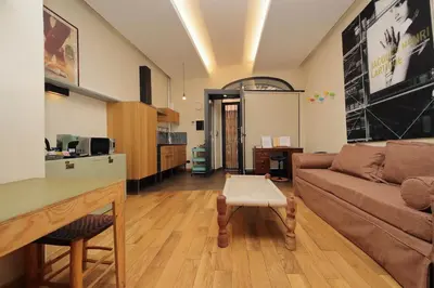 a living room with a couch and a table at Roma Suite Loft in Rome