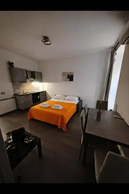 a bedroom with a bed with two towels on it at Re di Roma Home in Rome