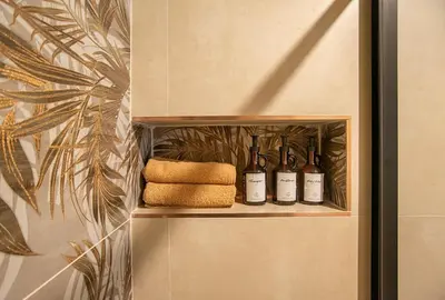 a kitchen with a counter and a clock on the wall at Pied-à-terre Ponte Milvio in Rome