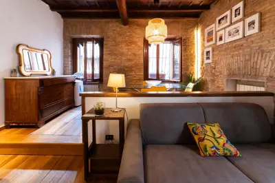 a living room with a couch and a table at Pantheon Private Apartment in Rome
