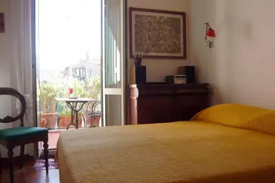 a bedroom with a bed and a window and a table at Laurina 4 - LOCAPPART in Rome