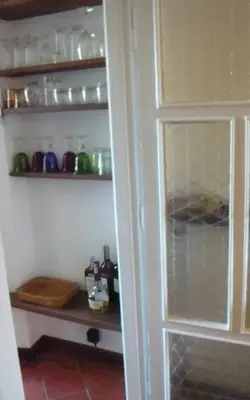 a door to a pantry with jars and bottles at Laurina 4 - LOCAPPART in Rome