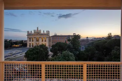 a view of a building from a balcony at San Giovanni Rooftop in Rome