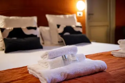 a pile of towels sitting on top of a bed at Pantheon Deluxe in Rome