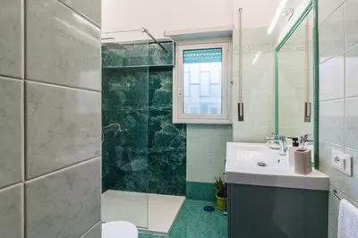 a bathroom with a sink and a shower at Comfort House in Rome