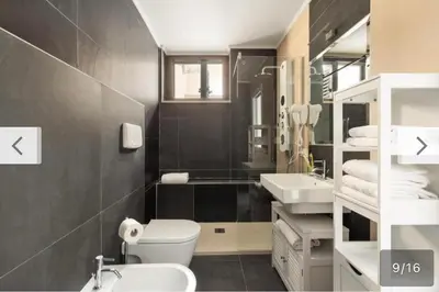 a bathroom with a toilet and a sink at Trastevere City Life Apartments in Rome