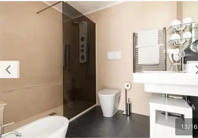 a bathroom with a shower and a toilet and a sink at Trastevere City Life Apartments in Rome