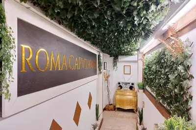 a hallway with a sign on the side of a building at 4BNB - Victoria Palace in Rome