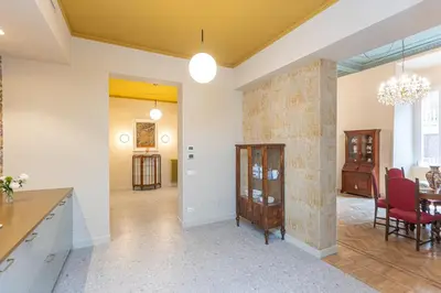 a living room with a table and a dining room at Amazing 3 Bedrooms Prati Vatican in Rome