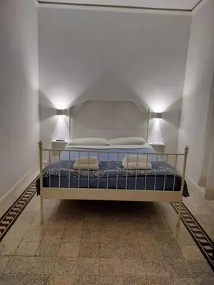 a wooden door with a window in a hallway at Vatican Room- all you need to sleep 3 in Rome