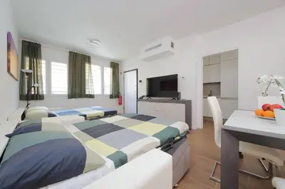 a bedroom with a large bed and a desk with a table at Sabelli 3 Villa Indipendente con Studio Privato in Rome
