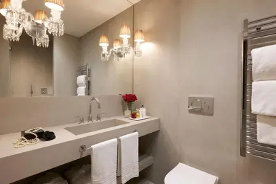 a bathroom with a sink and a mirror at Saphir Luxury Apartment in Rome
