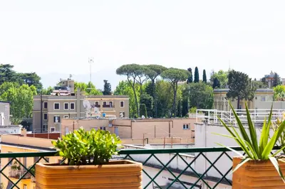 two potted plants sitting on top of a balcony at Constance Terrace Apartment by Rental in Rome in Rome