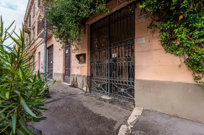 an entrance to a building with a wrought iron gate at Domus Sabelli in Rome