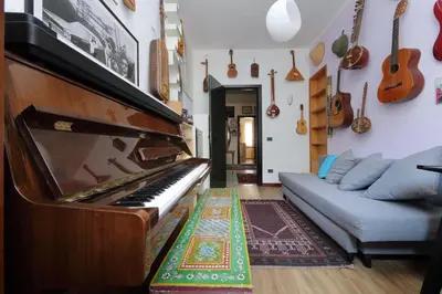 a living room with a piano and a couch at Giuliana in Rome