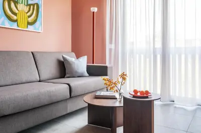 a living room with a couch and a table at Numa Rome Trastevere in Rome