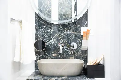 a bathroom with a sink and a mirror at Olimpico Luxury Rooms in Rome