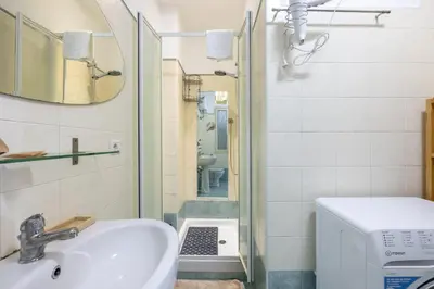 a bathroom with a sink and a toilet at Atelier Latino in Rome
