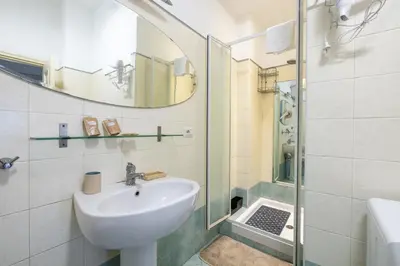 a bathroom with a sink and a shower at Atelier Latino in Rome