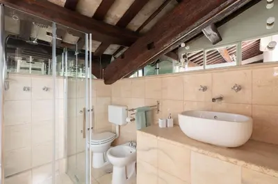 a bathroom with a sink and a toilet and a shower at Pantheon Palace Loft by RomeLoft in Rome