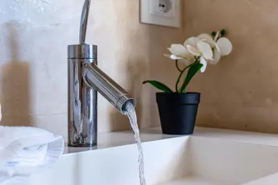 a sink with water coming out of a faucet at iFlat Spanish Steps Unique Panoramic Penthouse in Rome