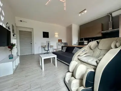 a living room with a couch and a table at Aurum Homes - Vaticano Lux Appartament in Rome