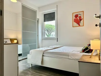 a bedroom with a bed and a glass shower at Aurum Homes - Vaticano Lux Appartament in Rome