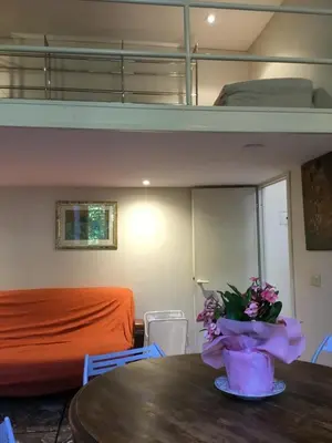 a room with a table and a bunk bed at Casa Betania in Rome